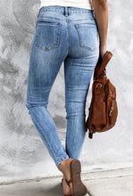Load image into Gallery viewer, Sky blue high rise distressed button up jeans
