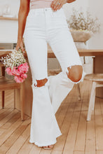 Load image into Gallery viewer, White distressed flare jeans
