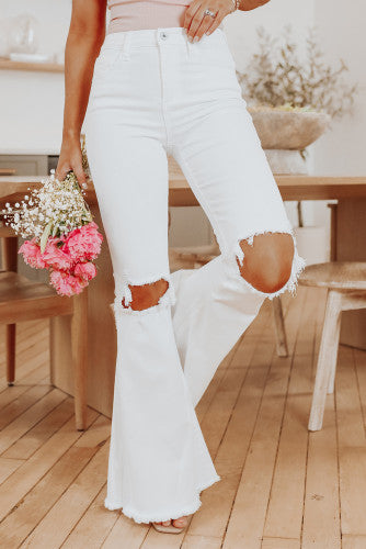 White distressed flare jeans