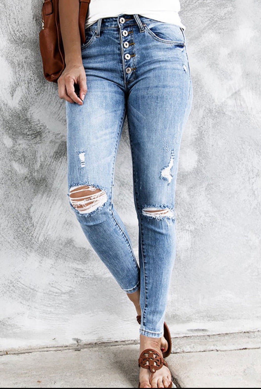 Sky blue high rise distressed button up jeans
