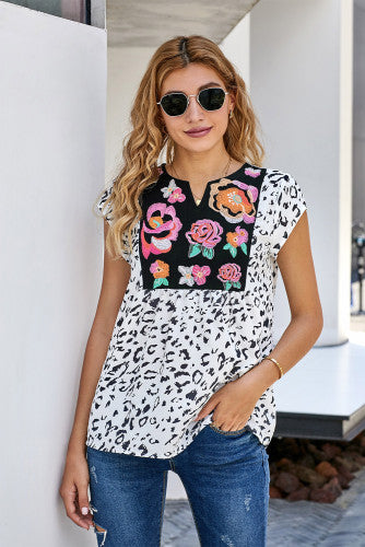 Wild flower embroidered animal print top